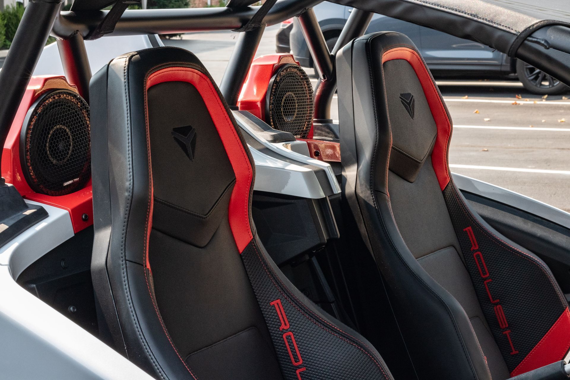 A close up of the seats of a vehicle in a parking lot