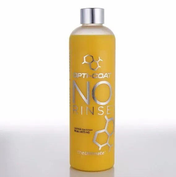 A bottle of opticoat no rinse sits on a white surface