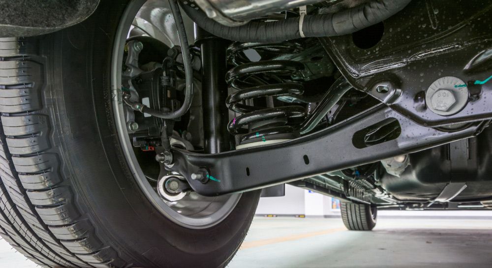 A Close up Of the Underside of A Car with A Tire and Shock Absorber — S&A Automotive Repairs Pty Ltd In Yarrawonga, VIC