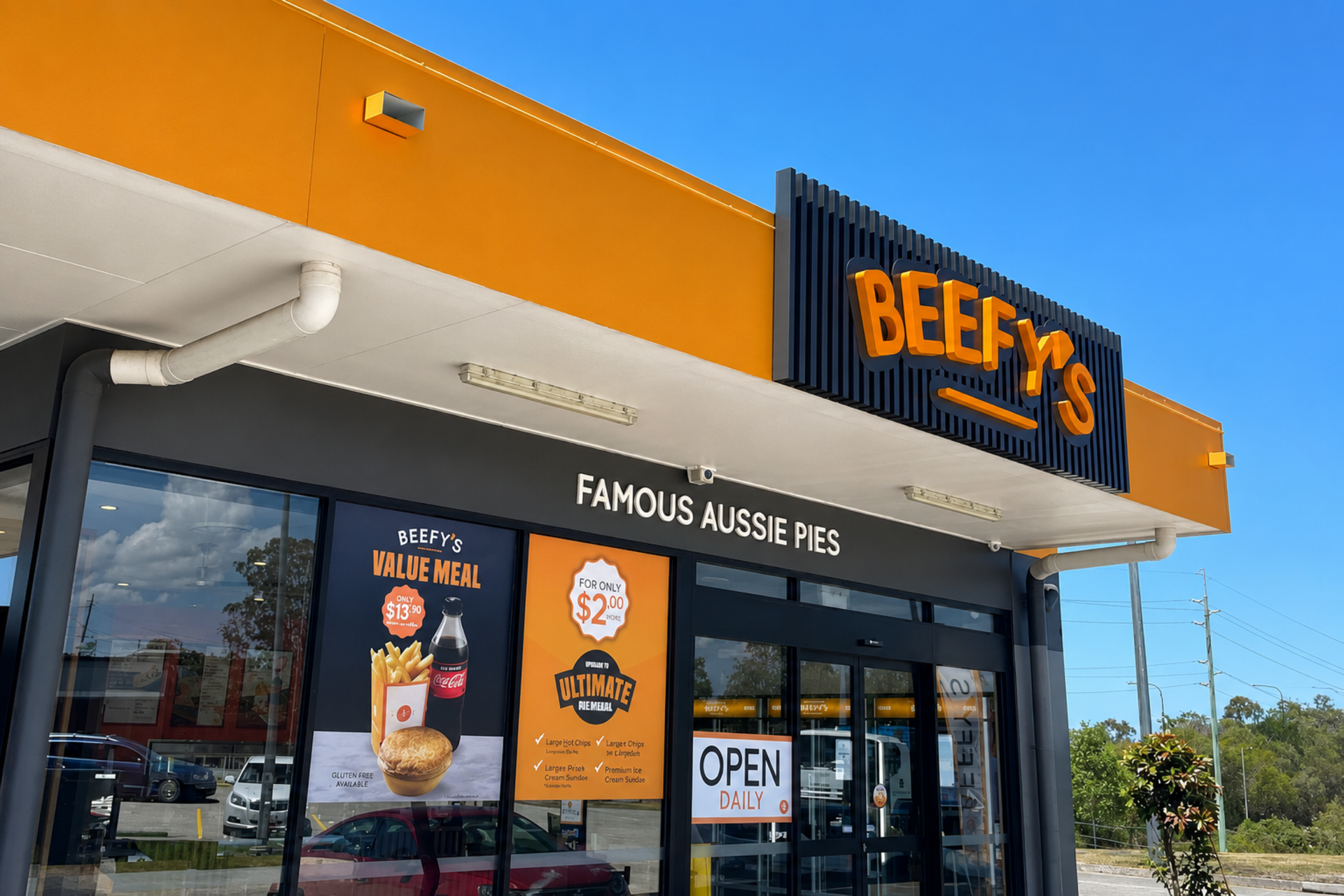 Beef O Brady’s storefront with orange and black signage and an open sign under a bright awning