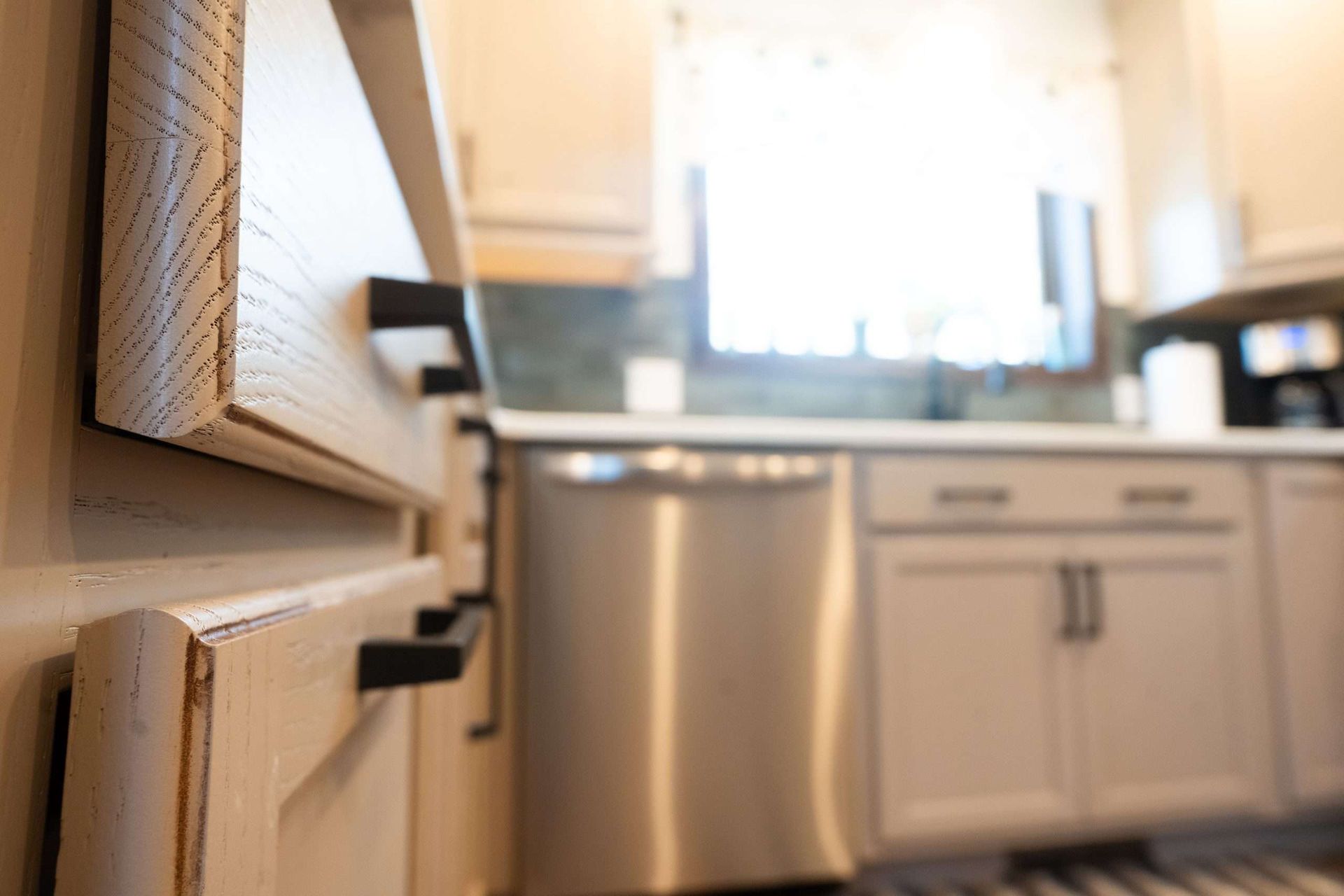 Kitchen cabinets and dishwasher in a bright, modern kitchen