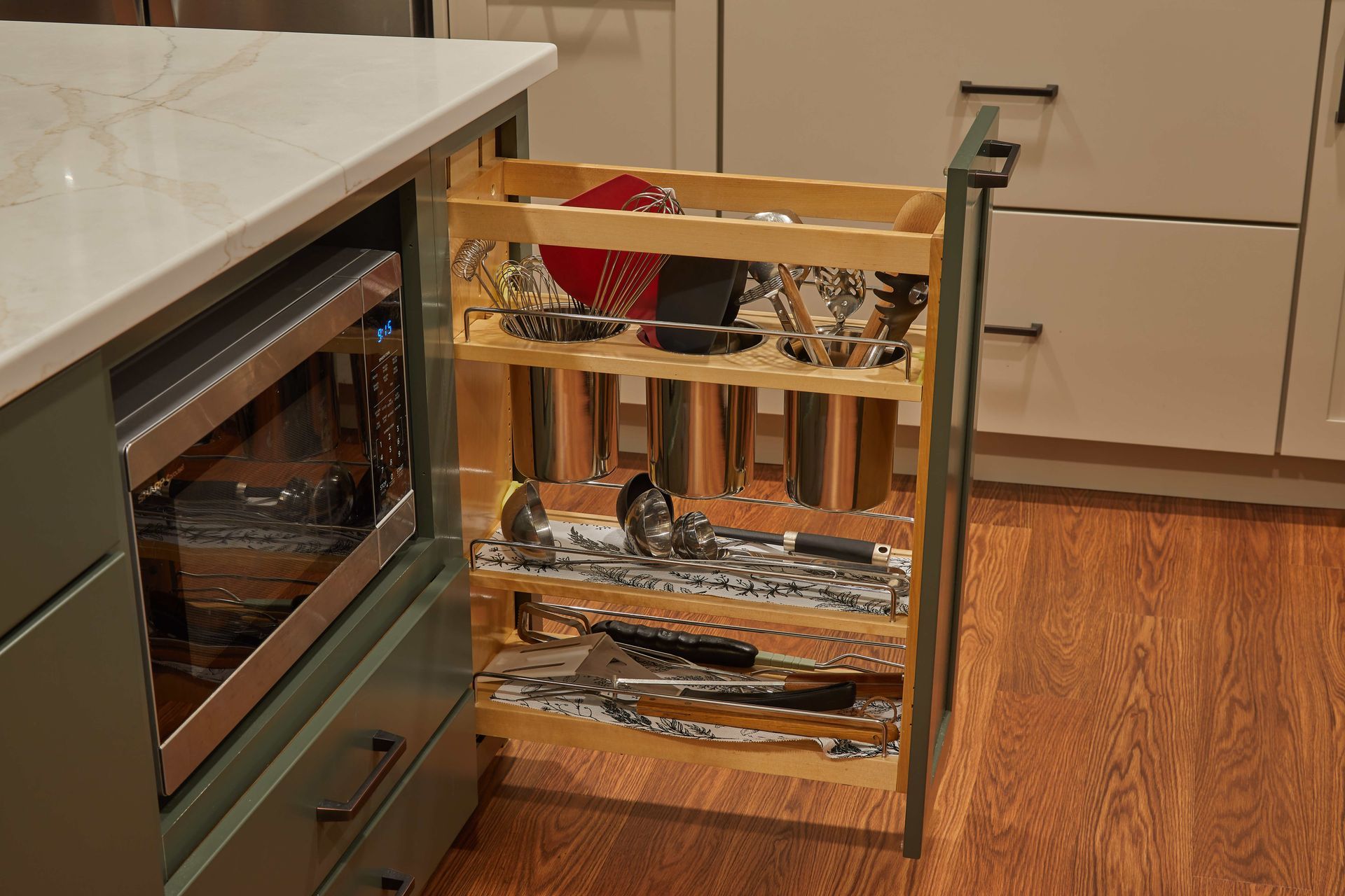 Partially open oven with foil-covered shelves in a kitchen beside a white countertop