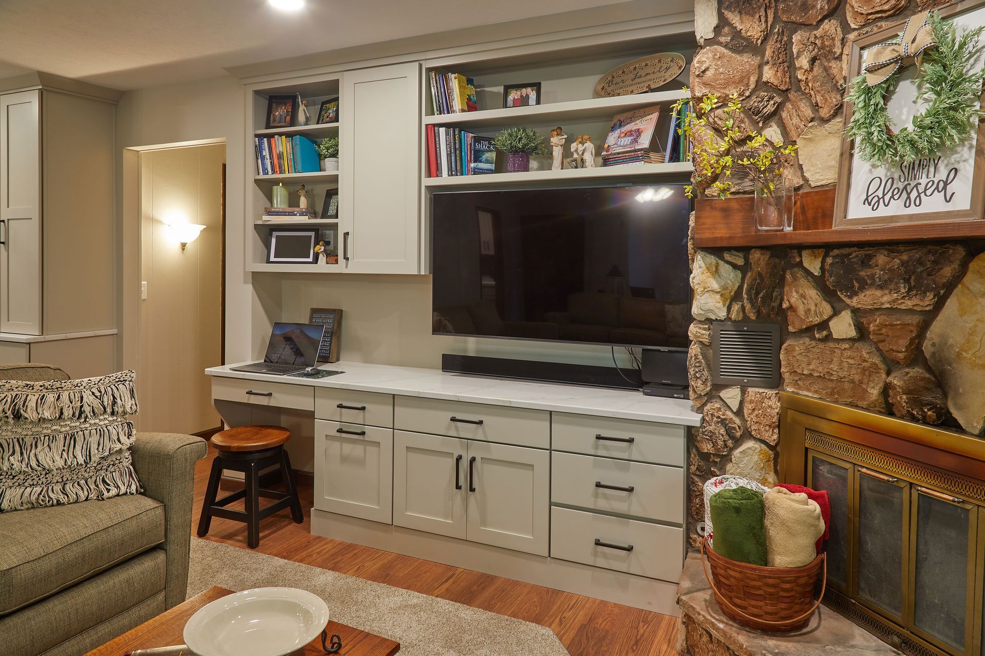 A kitchen with blue cabinets , white cabinets , and stainless steel appliances.