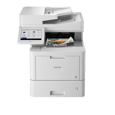 A white printer is sitting on top of a white table.