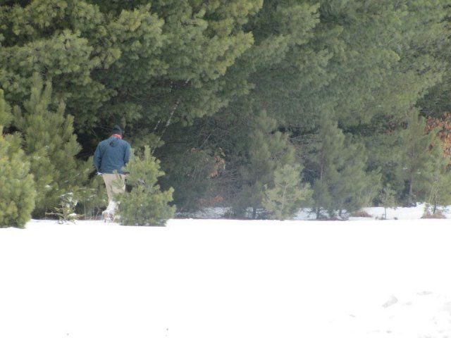 person in bushes