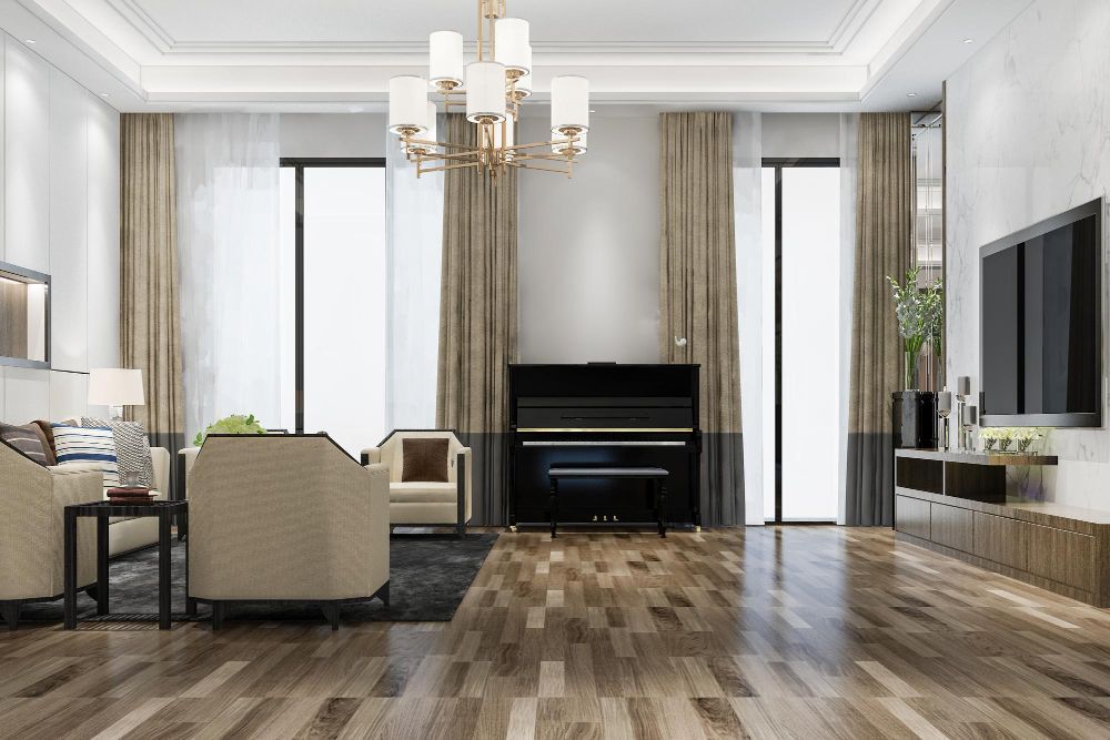 Living room with piano, seating, hardwood floors, large windows, and a chandelier.