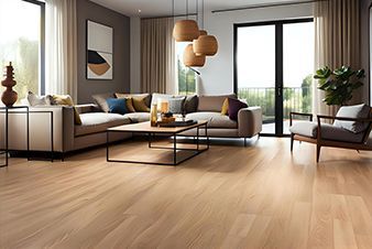 Living room with light wood floors, a large sectional sofa, and floor-to-ceiling windows.