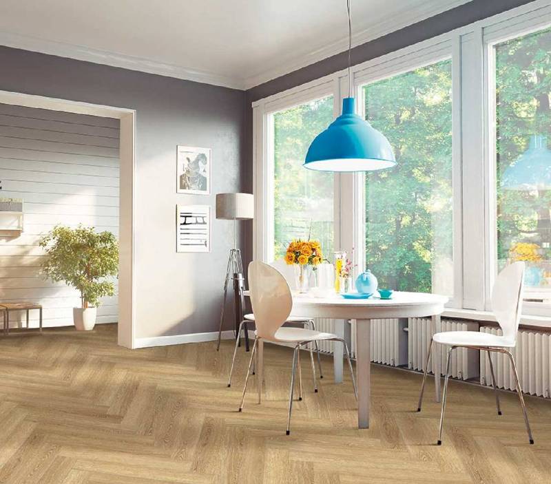 Dining room with a white table, chairs, large window, and light wooden herringbone floor.