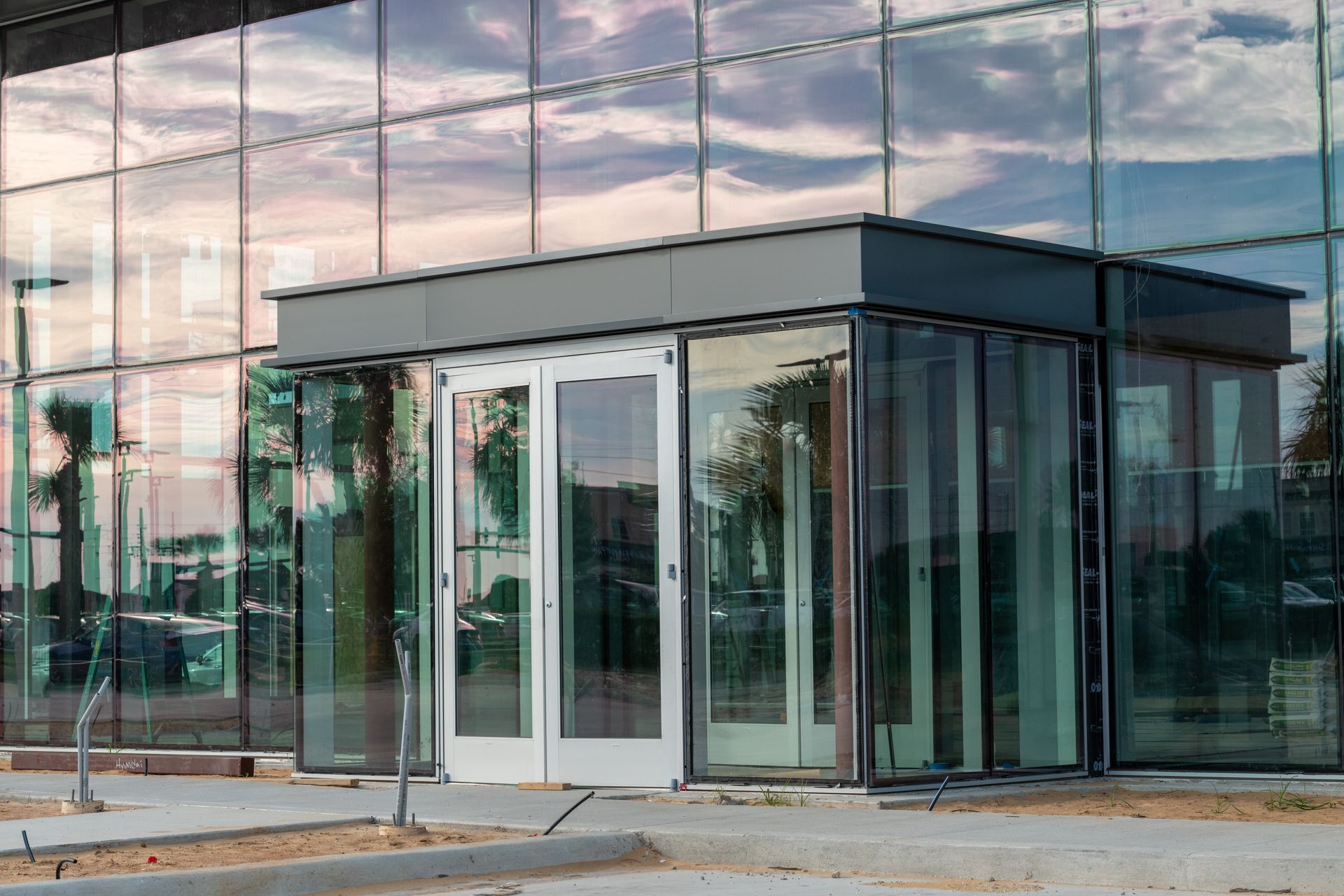 A large building with a lot of windows and doors.