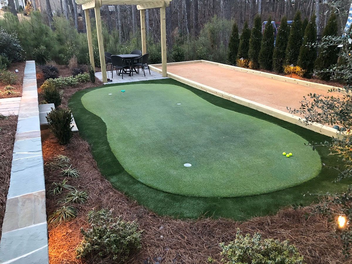 Landscaping services around backyard golf course from Brookscapes LLC