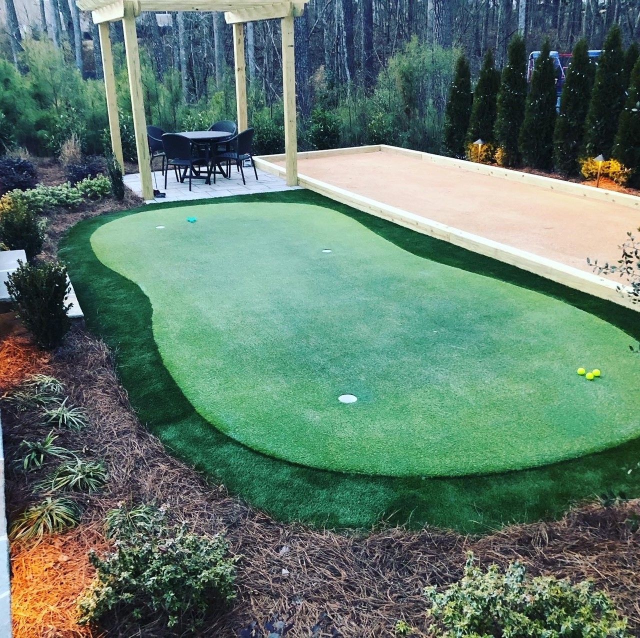 Garden bed shrub installation from Brookscapes LLC 