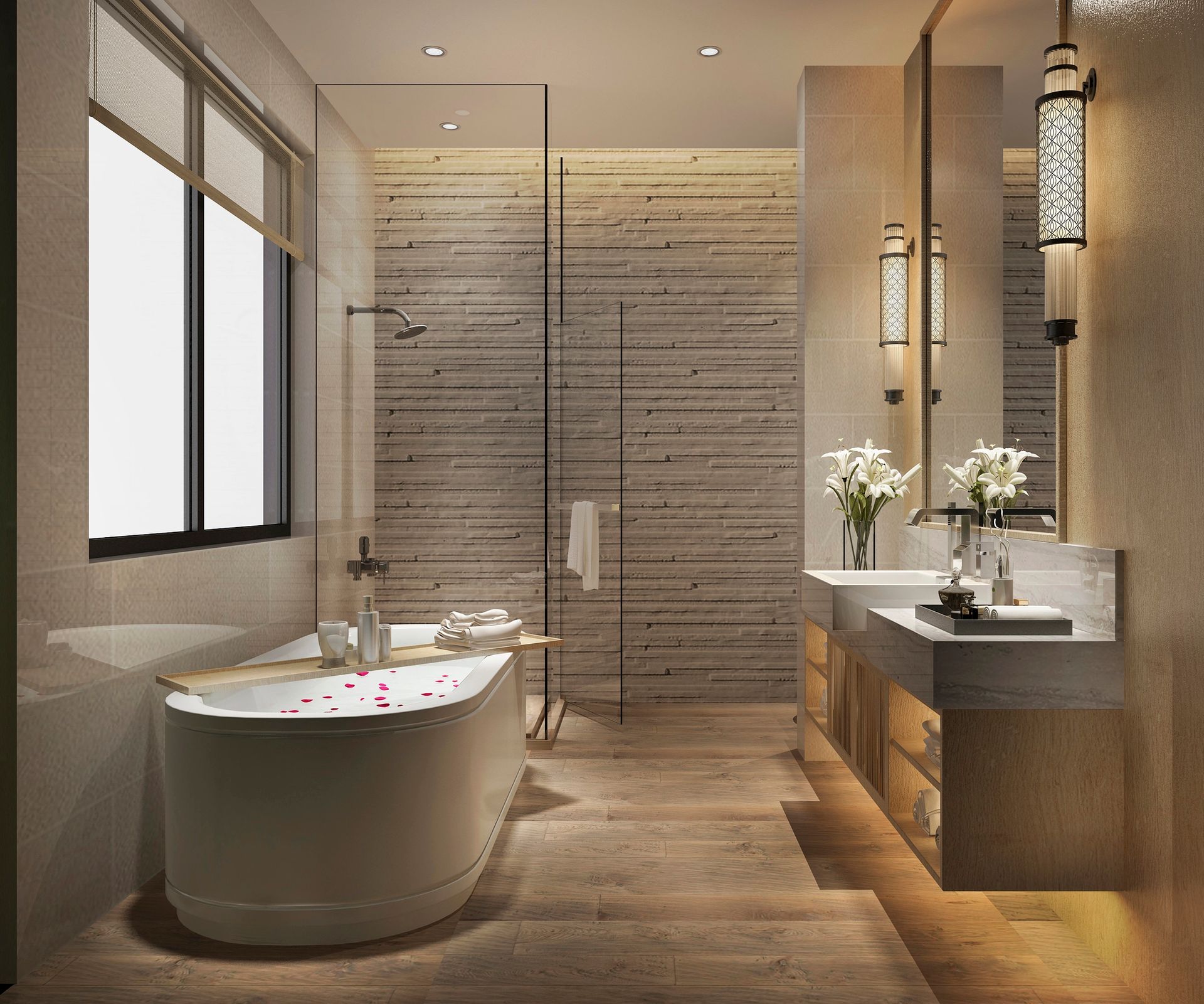 Bagno moderno con vasca freestanding bianca, doppio lavabo e parete in pietra texturizzata illuminata da una calda luce a incasso.