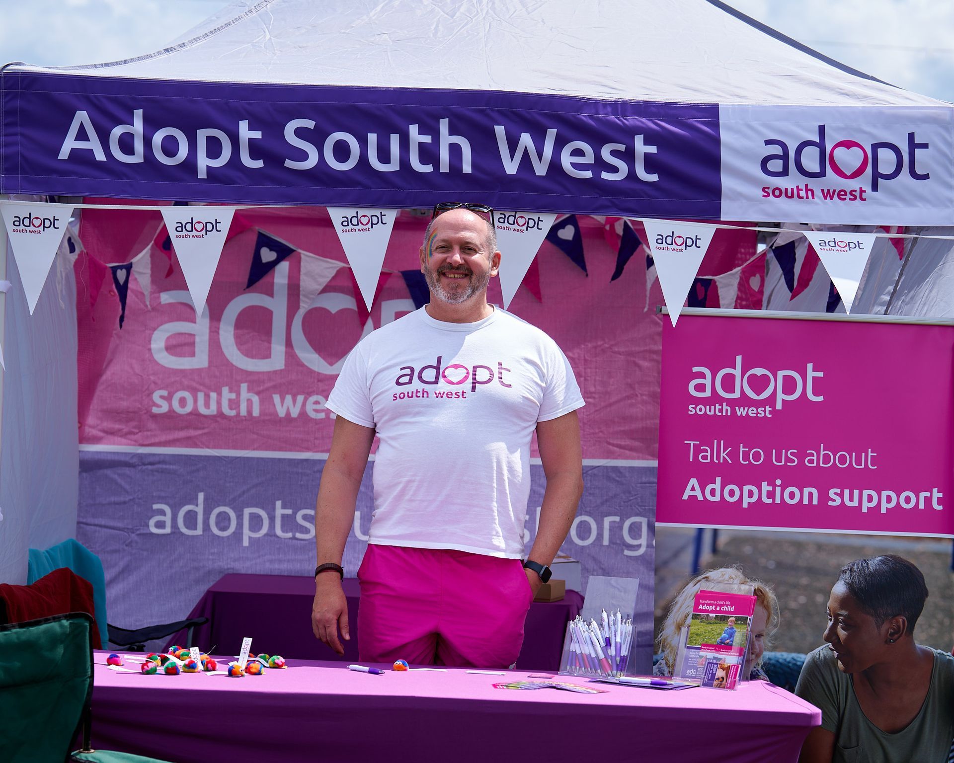 a man in front of adpot southwest stall