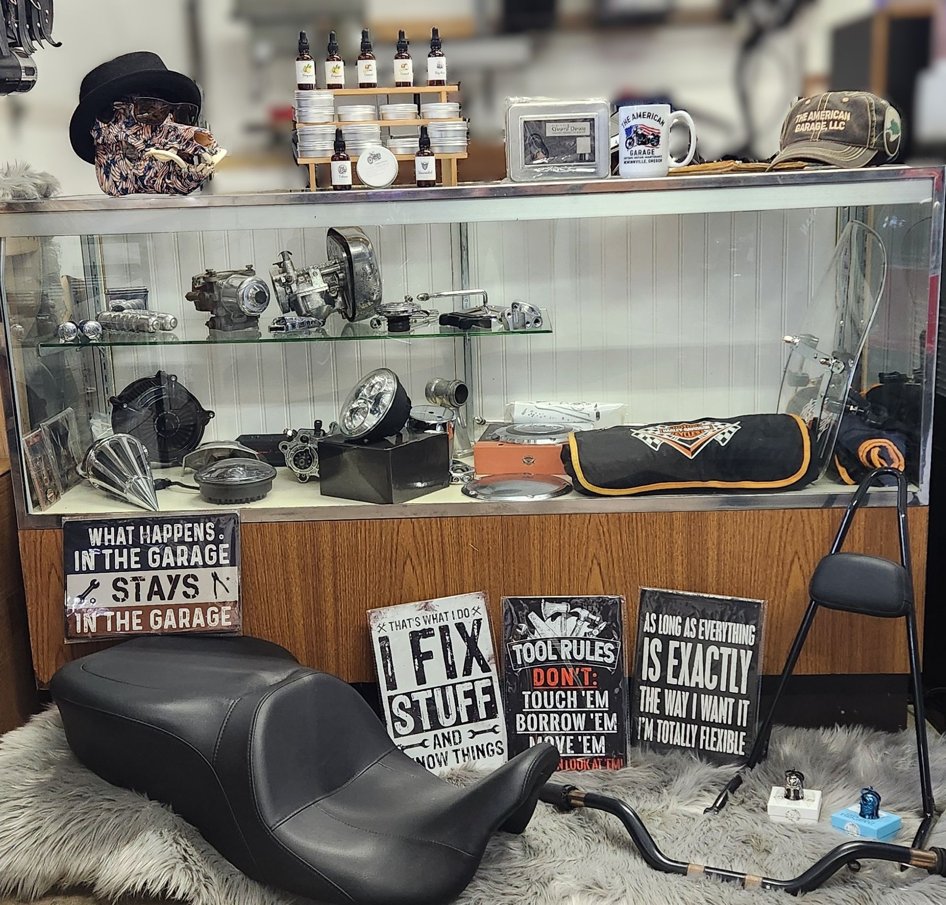 A man and a woman are sitting on a blue motorcycle.