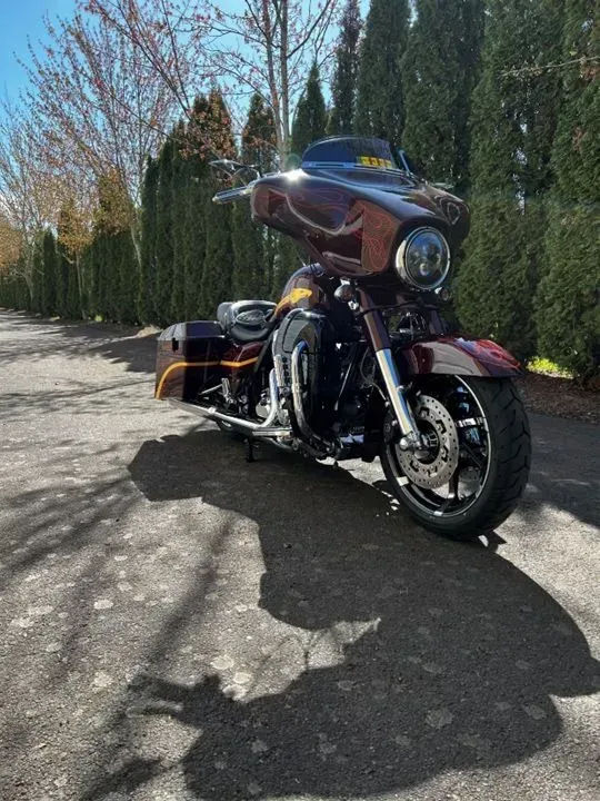 A motorcycle is parked on the side of a road.