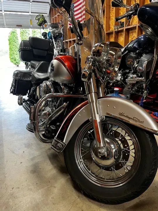 A harley davidson motorcycle is parked in a garage.