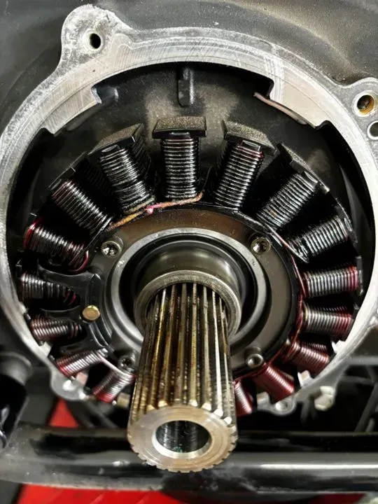 A close up of a gear with a shaft in it