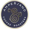 Amberjand Coffee Roasters circular logo in dark navy, gold, and white with ornate monogram text
