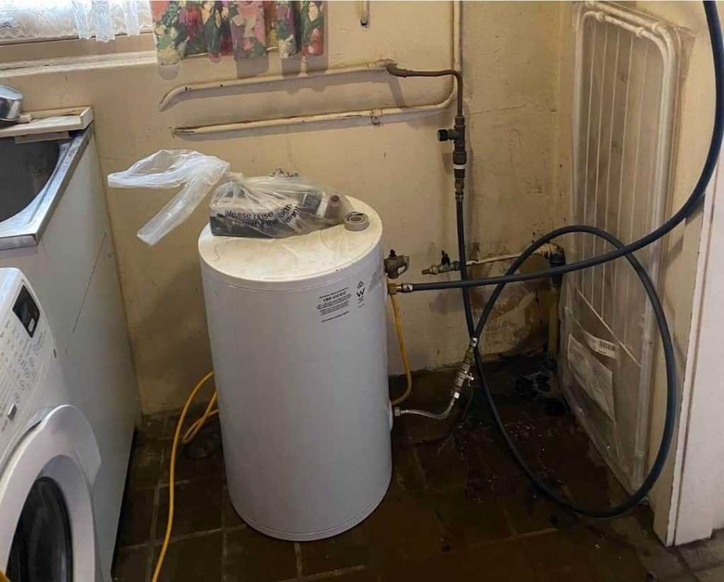 new rheem hot water tank in room
