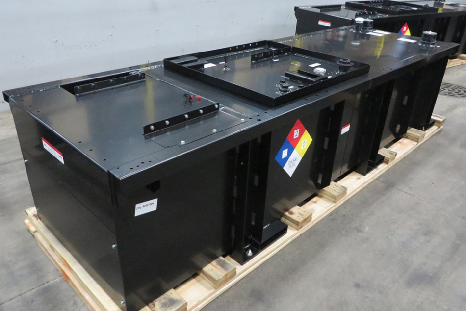 Custom-fabricated UL-listed sub-base fuel tank with integrated spill containment and safety labeling.