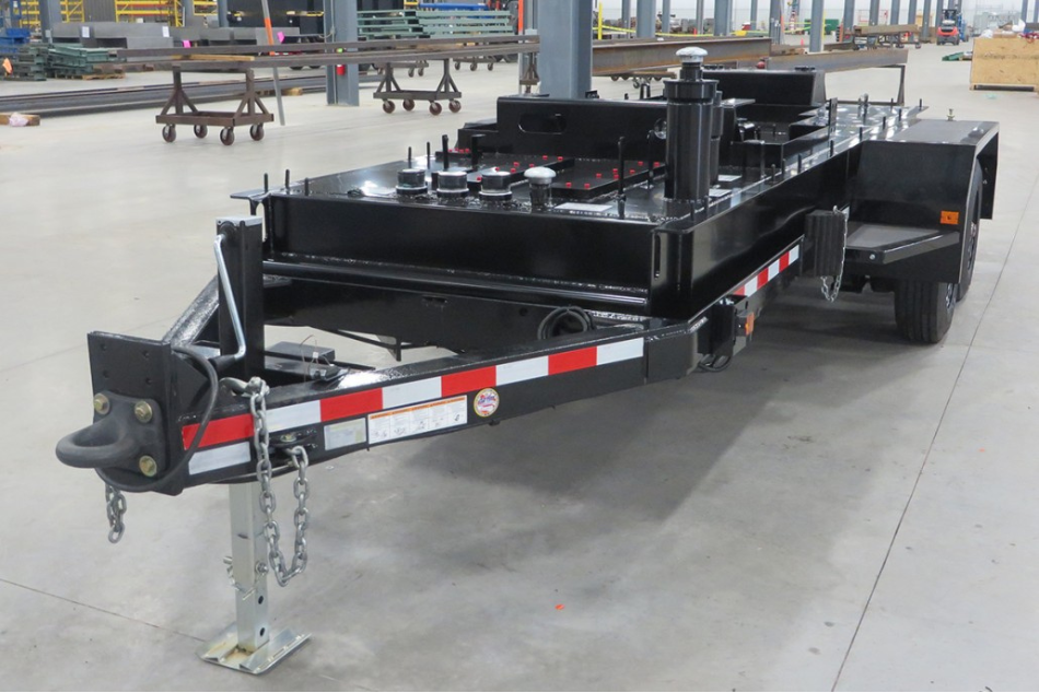 Finished tandem-axle industrial trailer featuring a custom black finish and DOT-compliant safety features.