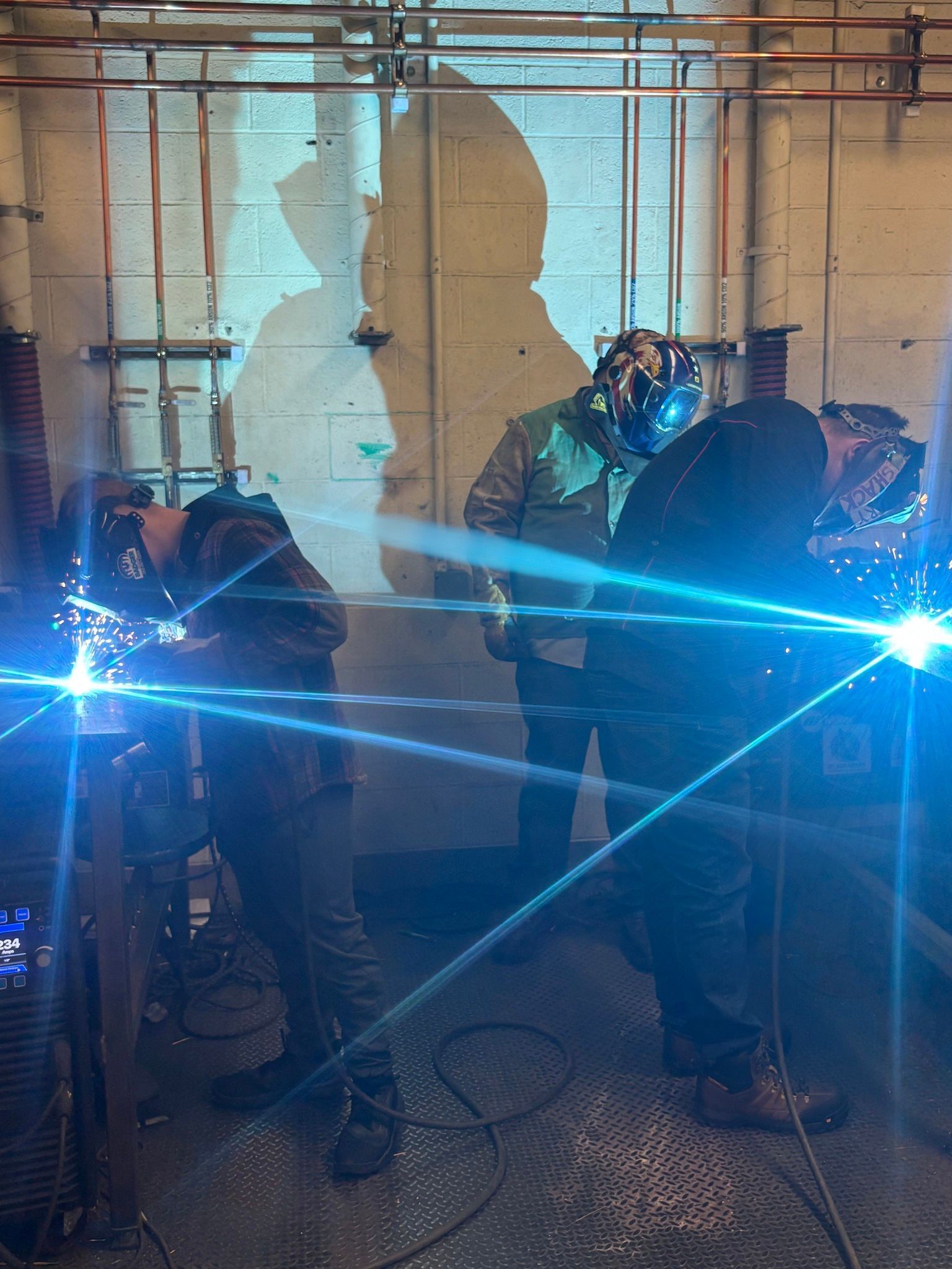 Certified weld instructor (CWI) mentoring students.