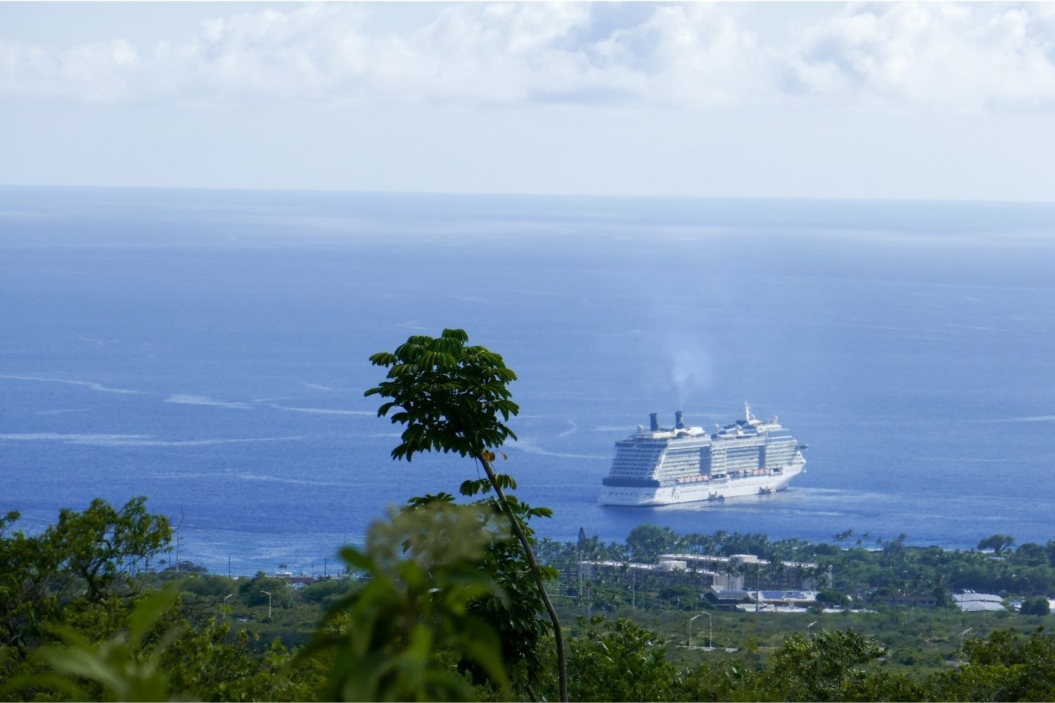 A cruise ship is floating on top of a body of water.