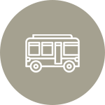 An icon of a bus in a circle on a white background.