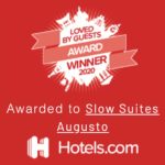 Distintivo rojo de Hotels.com: Loved by Guests 2020, otorgado a Slow Suites Augusta.