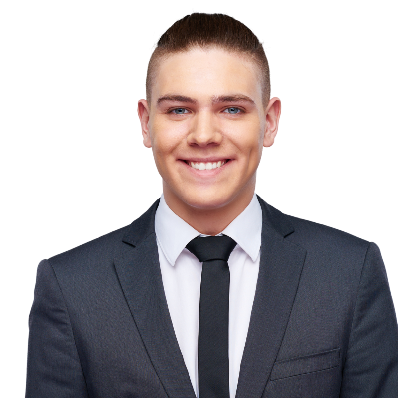 Smiling person in a dark suit, white shirt, and black tie on a white background