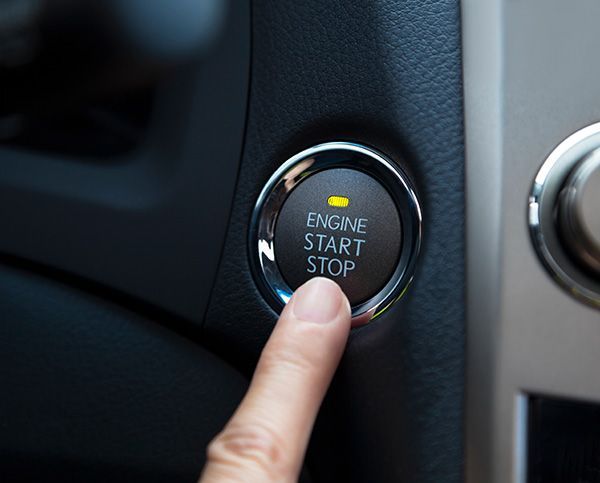 Finger pressing a car's