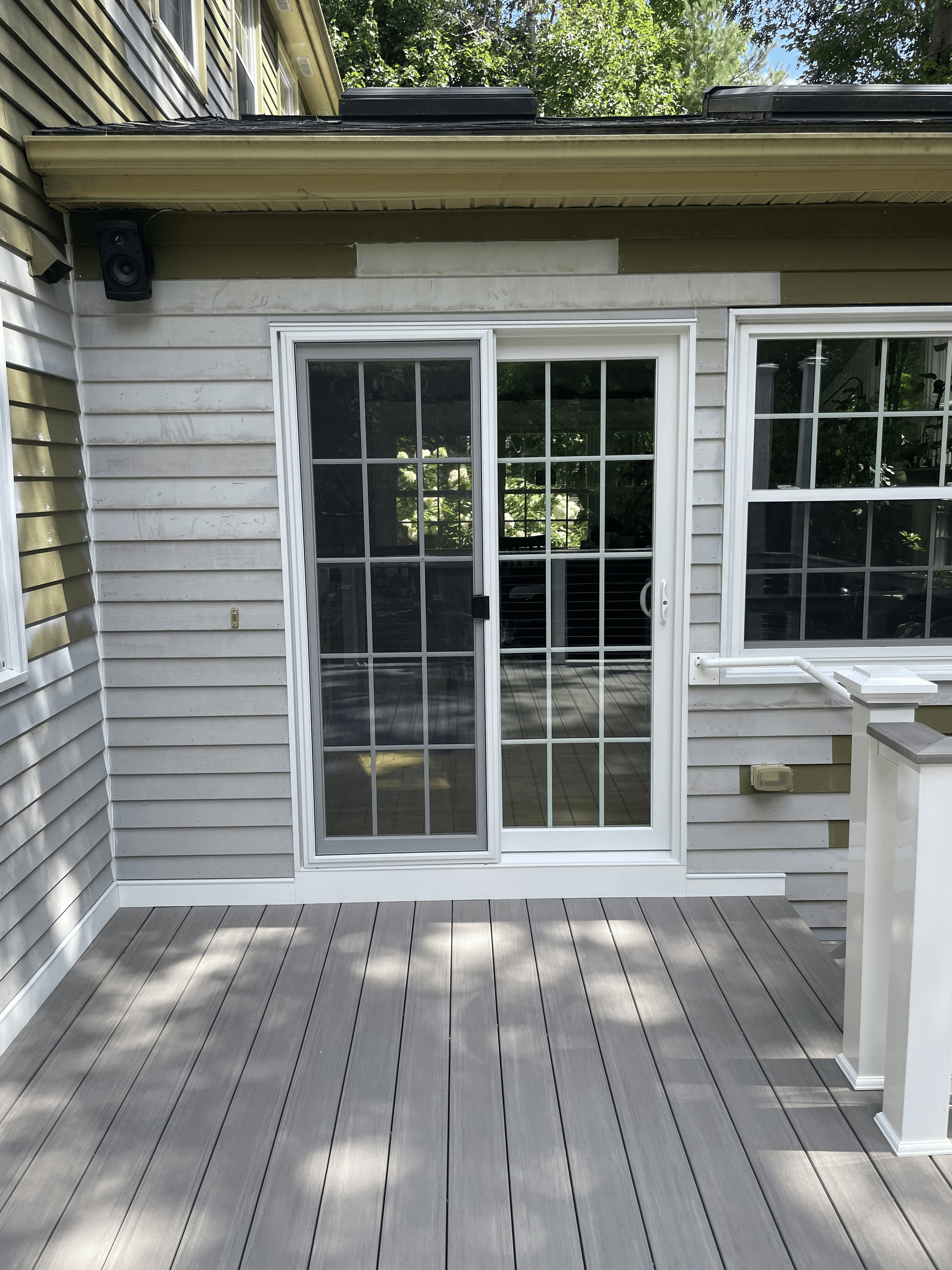 A white house with a sliding glass door