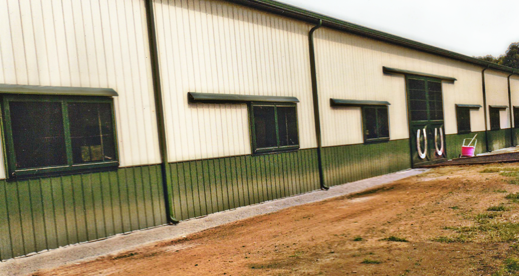 Hand Built Custom Sliding Windows and Custom Entry Doors for Horse Barn