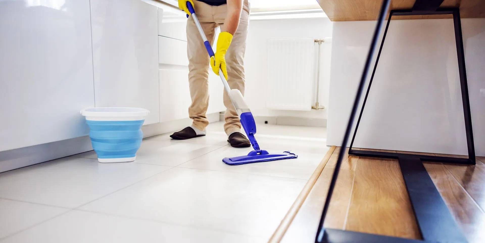 Floor cleaning service in Sydney cleaning a kitchen floor with advanced cleaning products