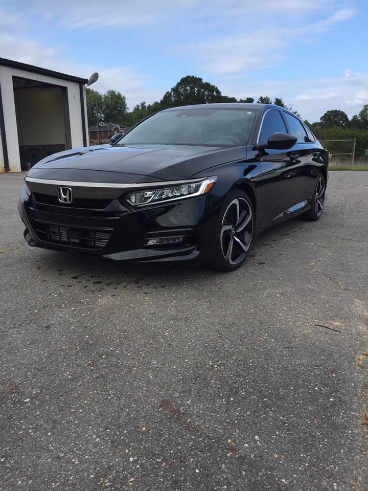 Black Honda Accord sedan parked on asphalt.