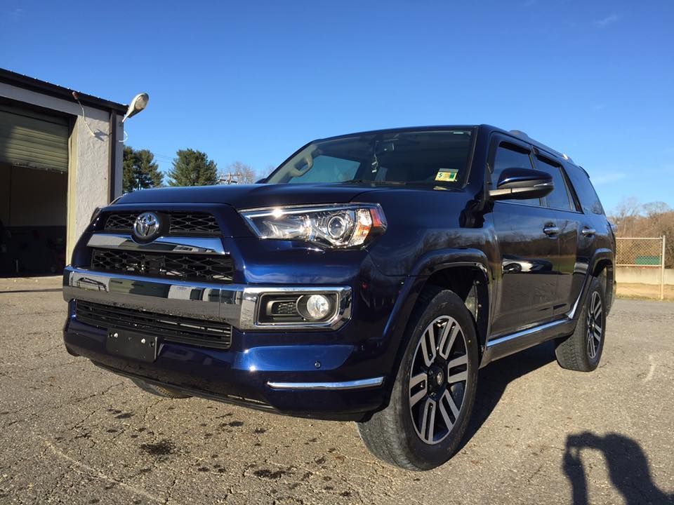 Blue Toyota 4Runner SUV parked outside on a sunny day.