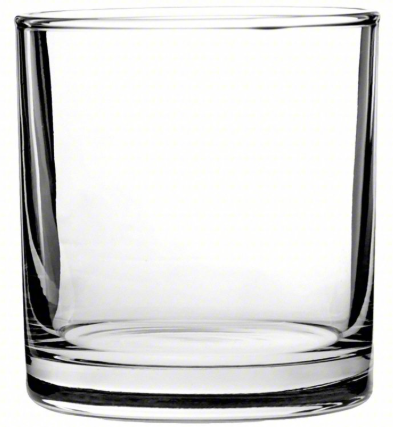 A clear glass is sitting on a white surface.