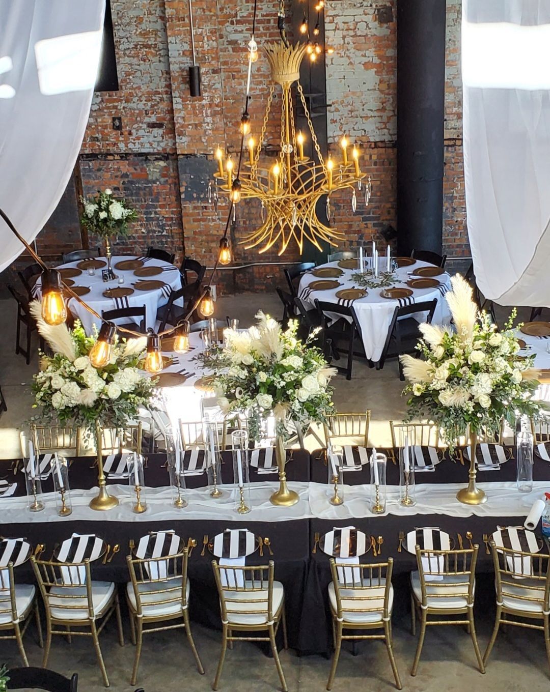 A long table with candles and flowers on it