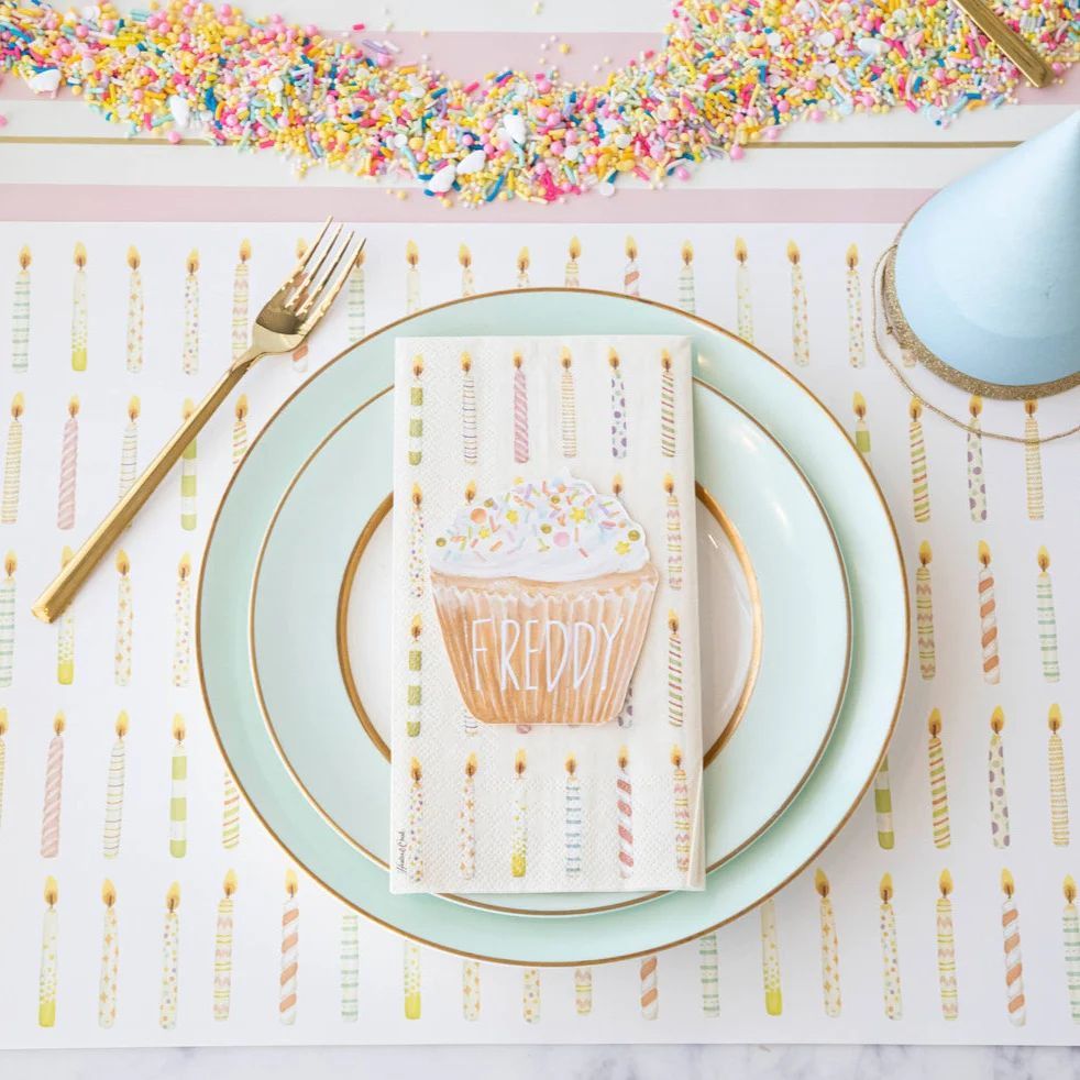 A plate with a napkin that says freddy on it