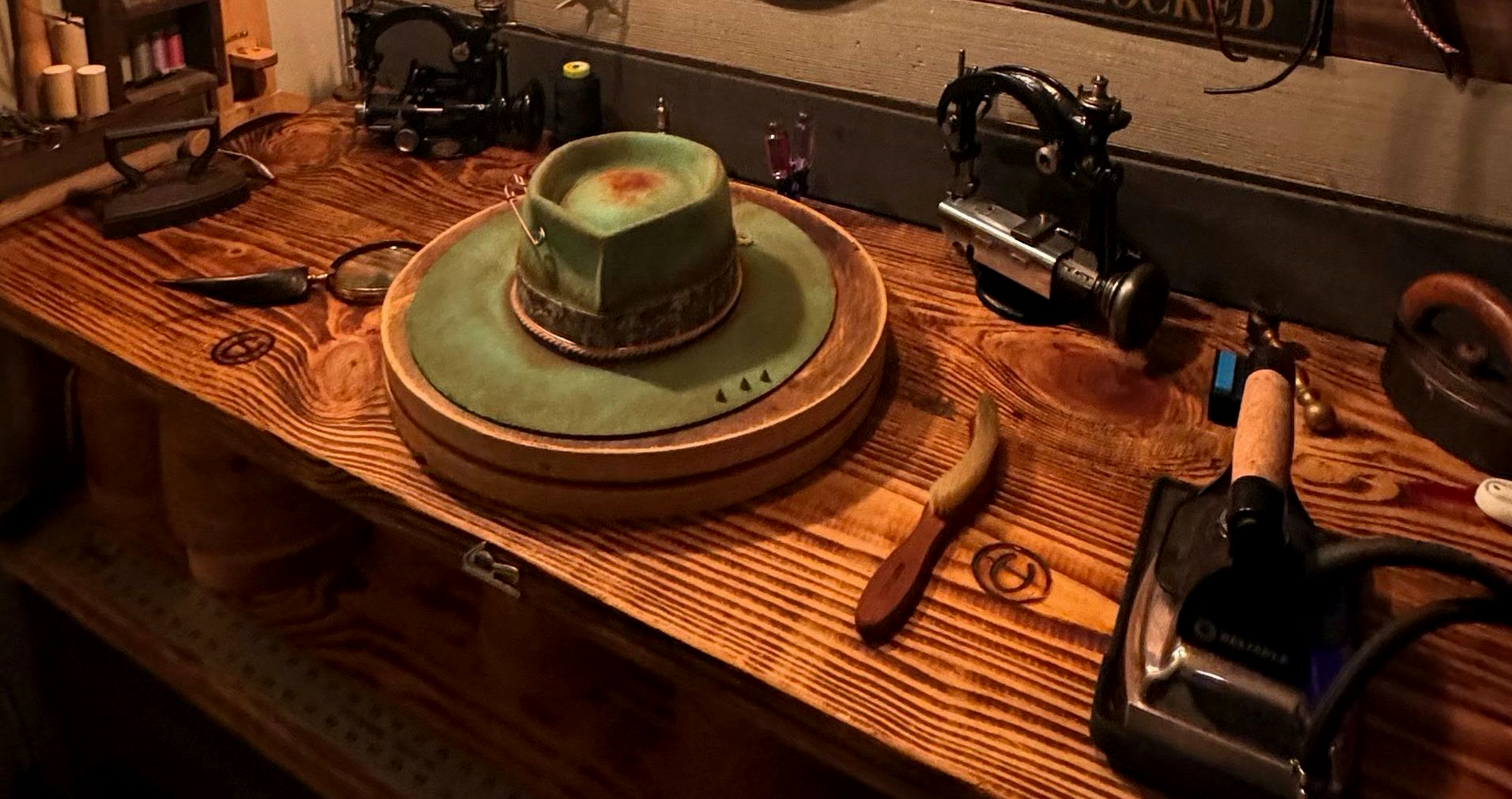 Charlie Lopez’s hatmaking workbench with a felt hat and vintage tools