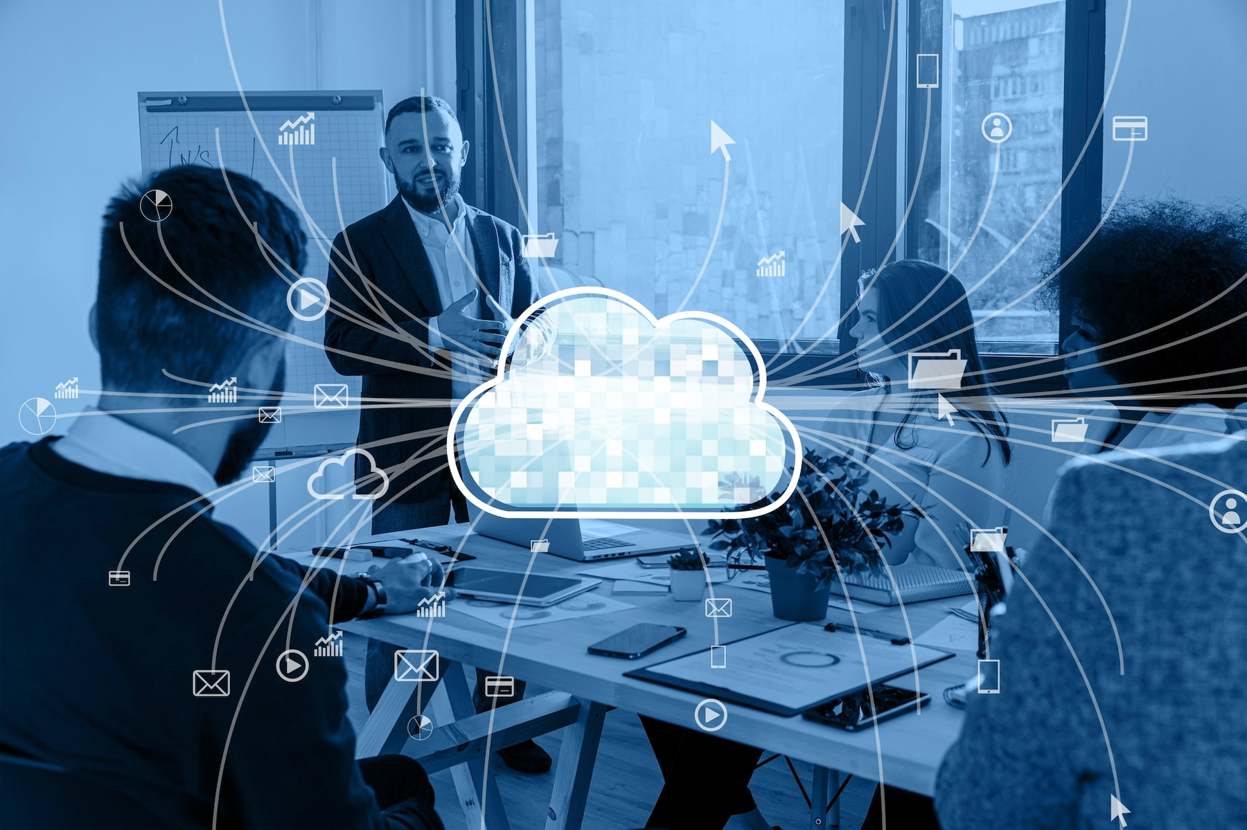 Business team in a meeting with a cloud icon at the center, surrounded by data flow lines and icons.
