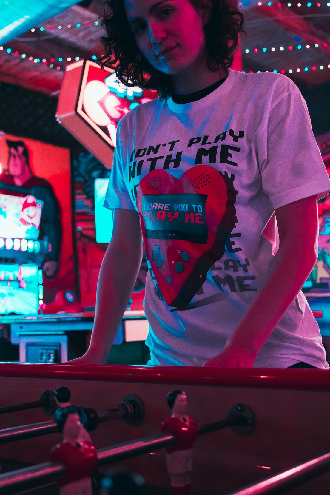woman on an arcade motorcycle.
