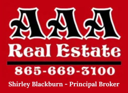 AAA Real Estate logo on red background with phone number 865-669-3100