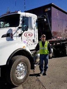 Truck delivering large roll off dumpster for disposal. Truck delivering large roll off dumpster for disposal.