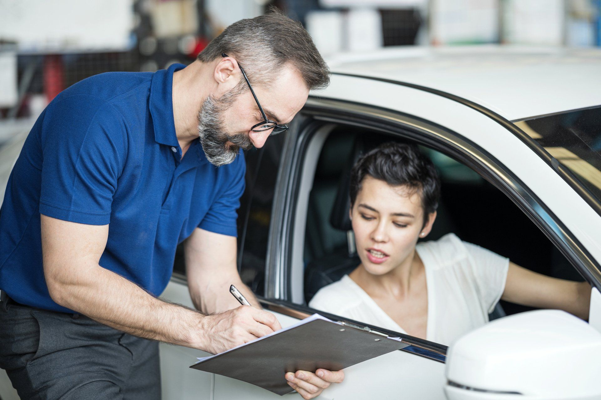Man Presenting Repair Expenses - Lubbock, TX - Wrench 'Em Auto & Diesel Repair