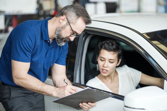Man Presenting Repair Expenses - Lubbock, TX - Wrench 'Em Auto & Diesel Repair