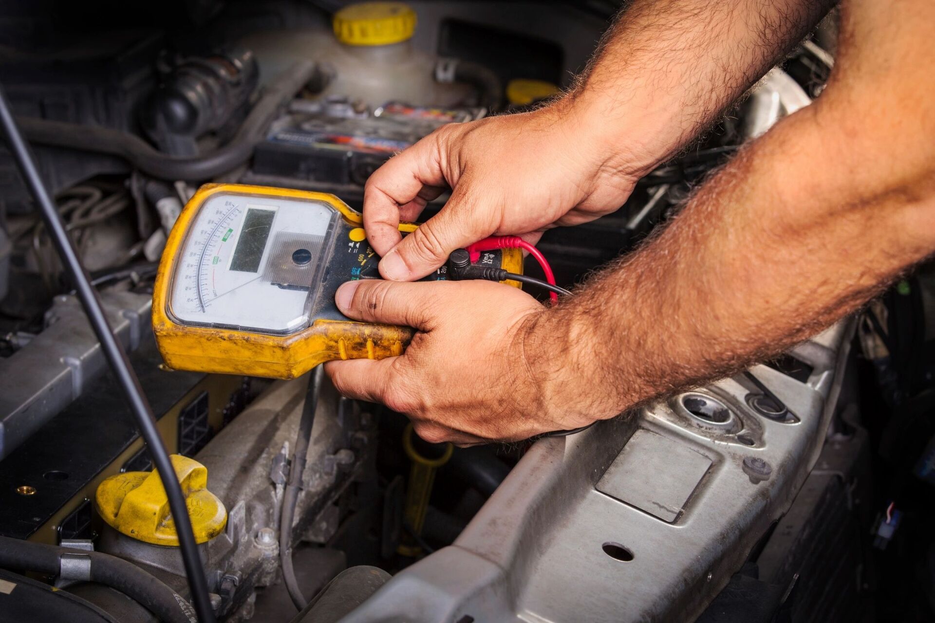 Mechanic Checking Battery Charge - Lubbock, TX - Wrench 'Em Auto & Diesel Repair