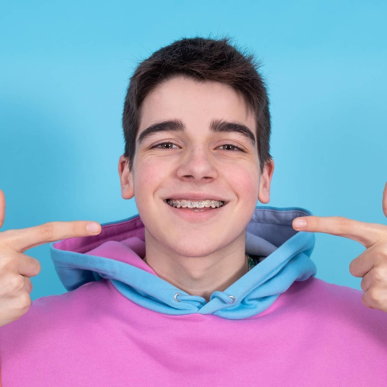 Happy smiling boy with dental braces