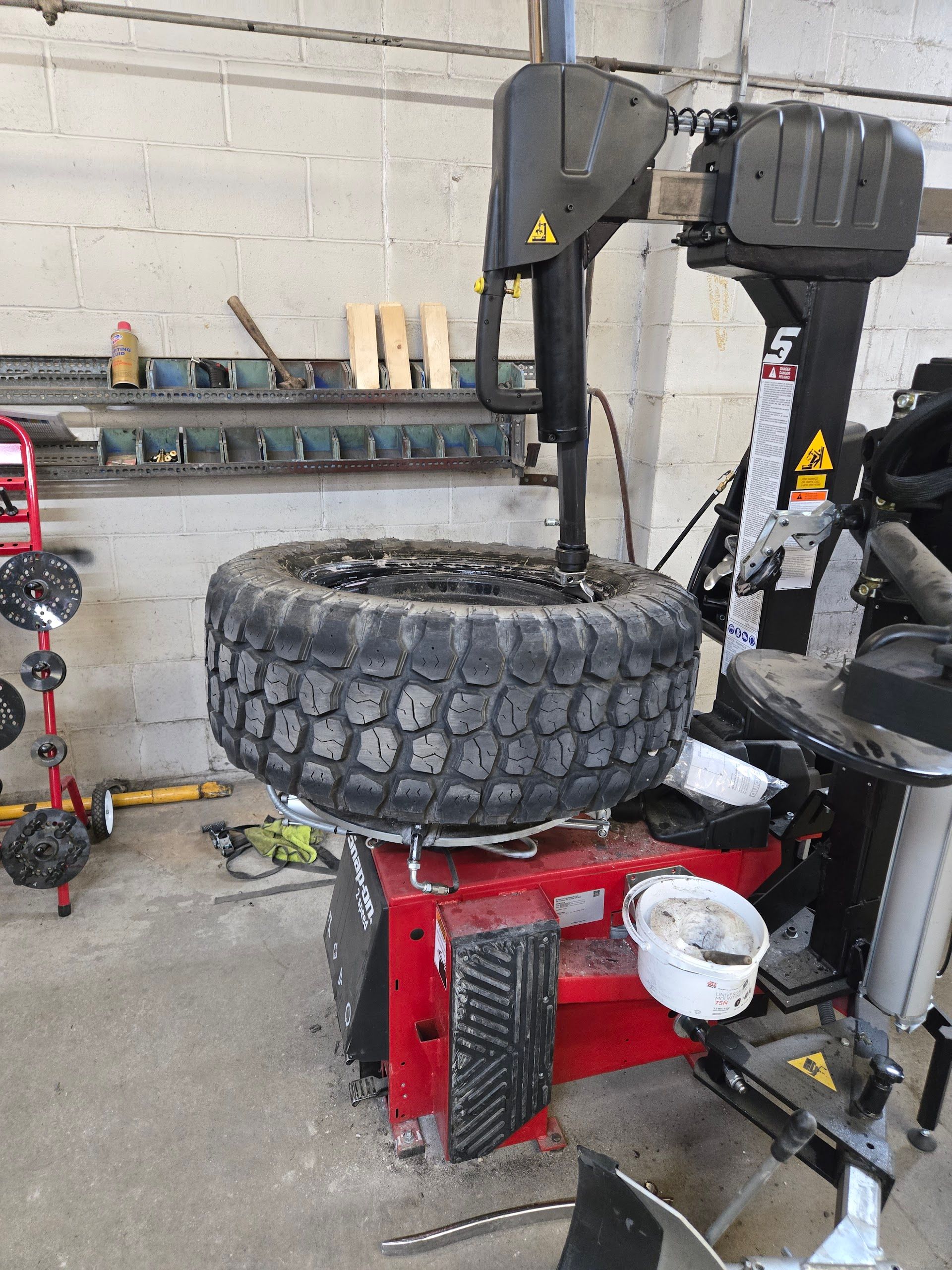Tire Installation Equipment With Mounted Tire | Lifeguard Tire and Auto