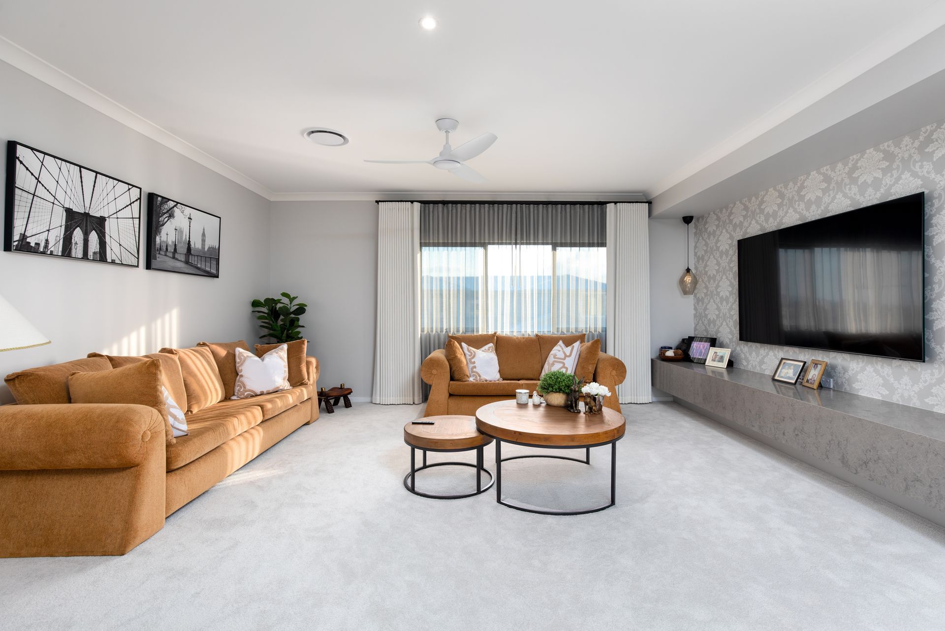 A living room filled with furniture and a flat screen tv.